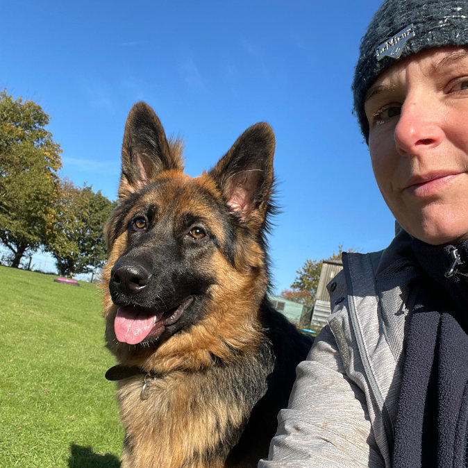 Vicki with a German Shepherd Dog at Village Pets Kennels