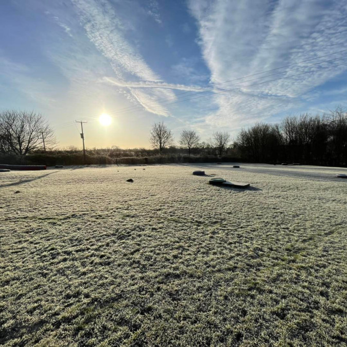frosty dog walking paddock at Village Pets Kennels in the morning sun
